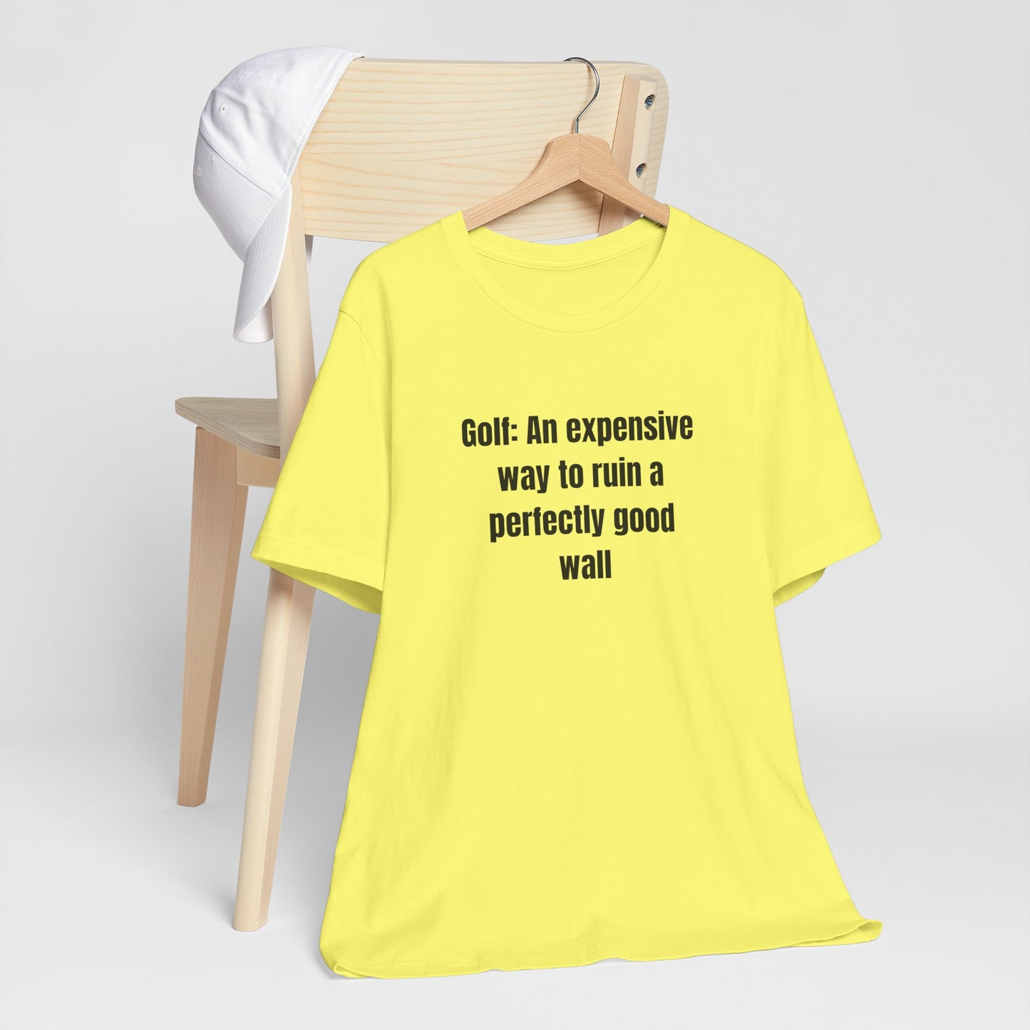 Golf Humor T-Shirt — "Golf: An expensive way to ruin a perfectly good wall"