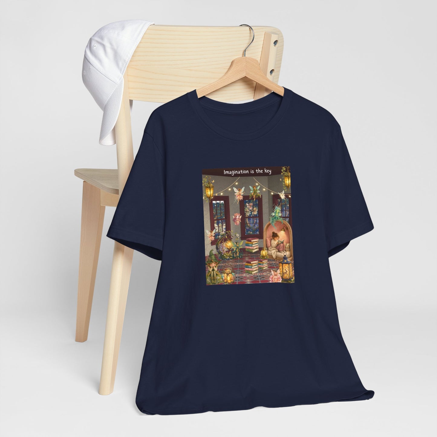 T-Shirt — Cozy Nighttime Reading Scene "Imagination is the Key"