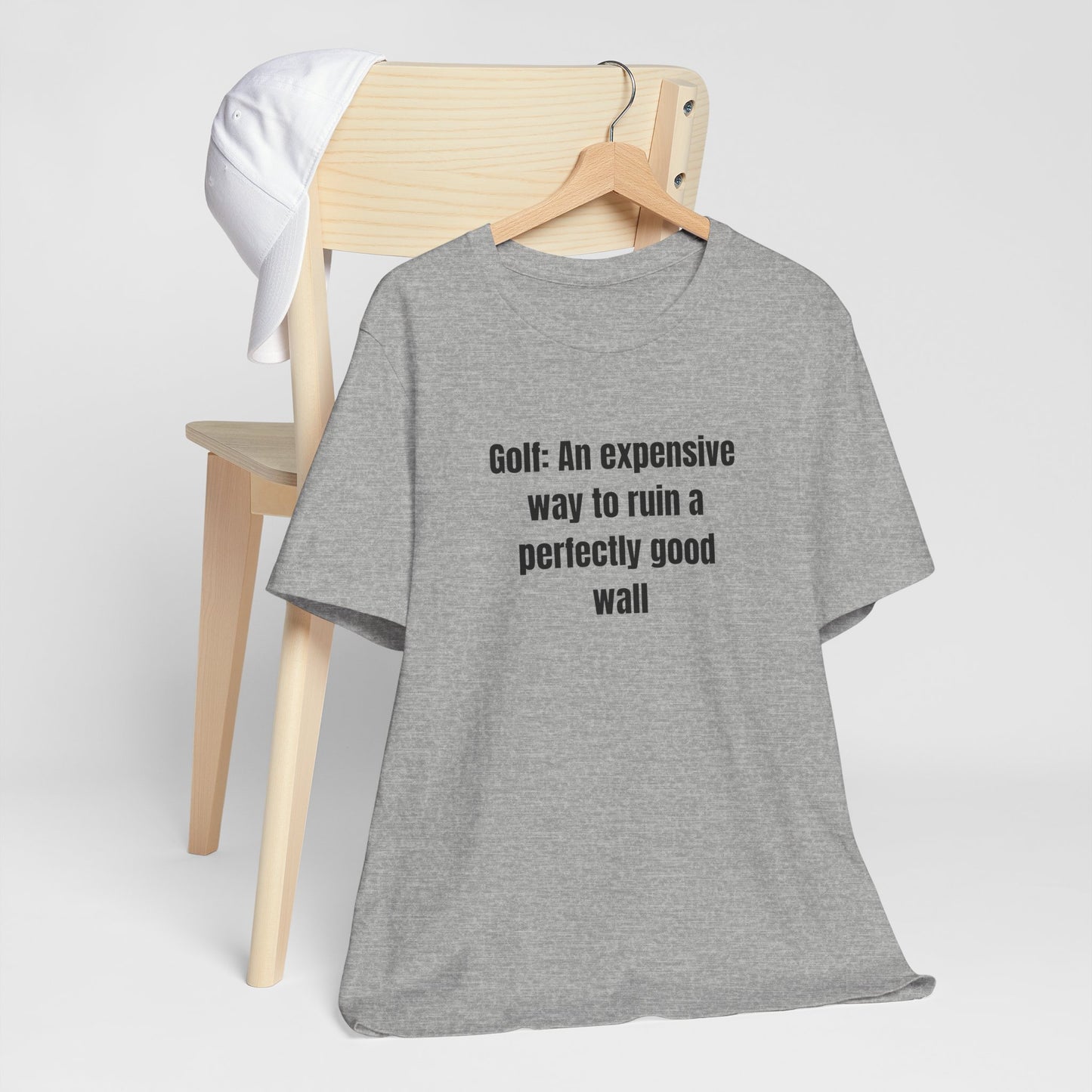 Golf Humor T-Shirt — "Golf: An expensive way to ruin a perfectly good wall"