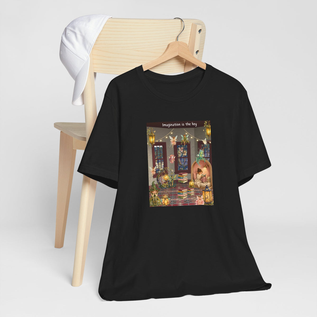 T-Shirt — Cozy Nighttime Reading Scene "Imagination is the Key"