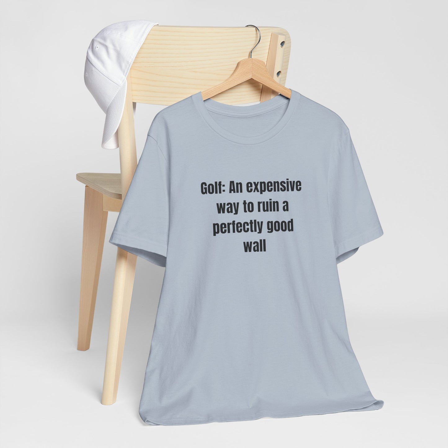 Golf Humor T-Shirt — "Golf: An expensive way to ruin a perfectly good wall"