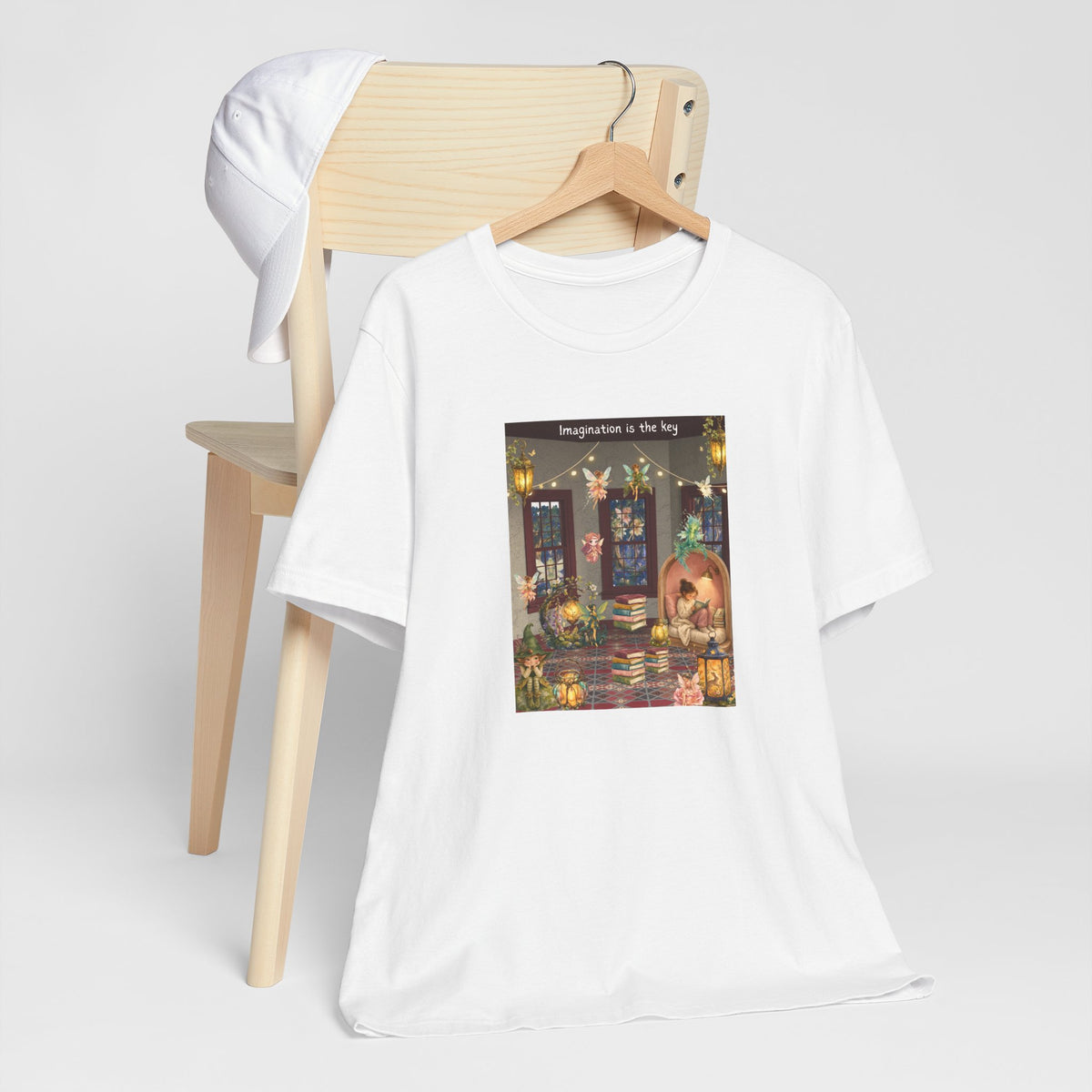 T-Shirt — Cozy Nighttime Reading Scene "Imagination is the Key"
