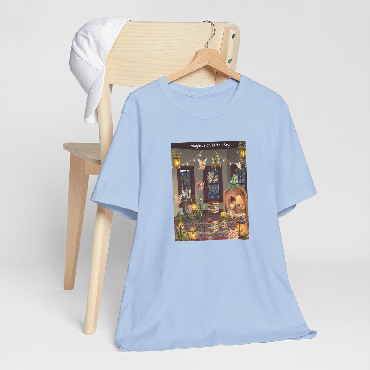 T-Shirt — Cozy Nighttime Reading Scene "Imagination is the Key"